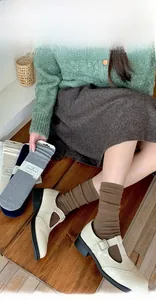 Close-up of silk wool waffle knit crew socks in coffee brown with vintage leather shoes