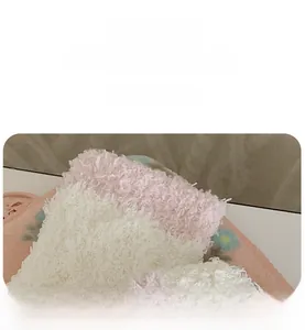 Close-up of soft coral fleece socks with high elasticity and plush pink texture