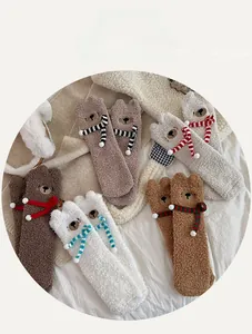 Detail of coral fleece bear socks with 3D ears and cute embroidered faces in multiple colors