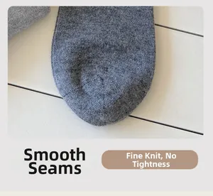 Close-up of flat toe seam and delicate knit texture on gray cashmere-like socks