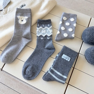 Cute gray thermal socks in four patterns including polka dots, stripes, and dog embroidery