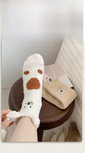 Detail of coral fleece socks with cute cartoon embroidery and soft 3D ears
