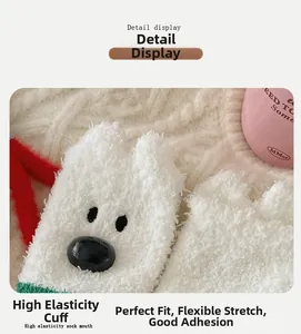 Detail of soft coral fleece socks featuring elastic cuff and cute cartoon dog face design