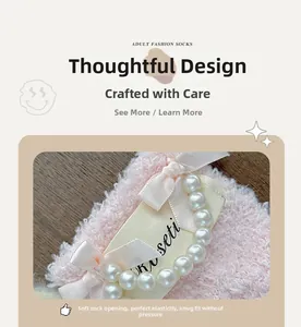 Detail of coral fleece sock featuring delicate white pearl beads and silk ribbon bow