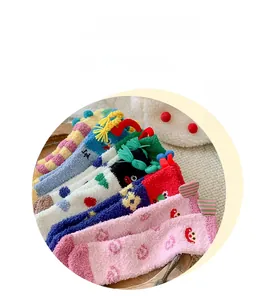 Detailed view of colorful coral fleece winter socks with cute cartoon 3D ears and patterns