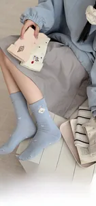 Close-up of cute dog embroidery detail on breathable cotton crew socks for women