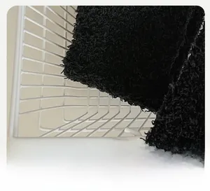 Detail of reinforced 3D heel on thick black coral fleece sock for winter warmth