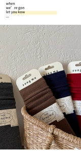 Detail showing high-quality silk wool knit texture of socks in various autumn colors
