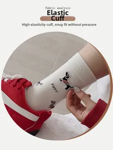 Close-up of white cotton sock with cute puppy patch and high-elastic ribbed cuff