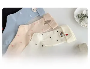 Detailed view of women's cotton socks with cute animal embroidery and folded cuffs