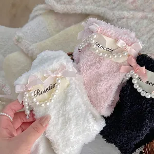 Thick coral fleece socks with pearl chain and bow decoration in white, pink and black