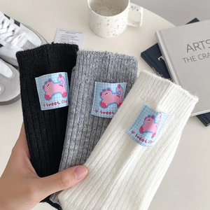 Chic ribbed wool socks in black white and grey with cute cartoon cat heel patches