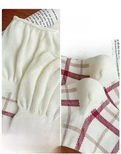 Detailed view of elastic ribbed cuff and 3D heel on British style plaid socks