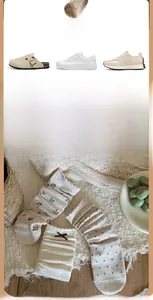 Detail of floral and bow patterned cotton socks in various warm oat milk color designs