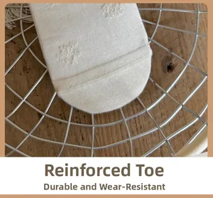 Close-up of reinforced sock toe featuring durable high-density knit and floral texture