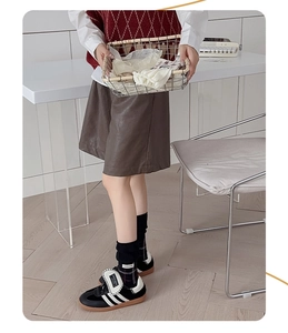Retro plaid socks styled with black sneakers and vintage outfit in a cozy scene