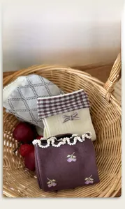 Three-pack cotton knit socks with argyle patterns, lace bows, and cherry embroidery