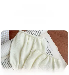Detail of high-elastic white knitted sock cuff showing non-slip ribbed texture and quality