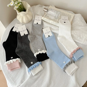 Five-pack women's mid-calf socks with heart buttons and ruffle trim in five soft colors