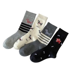 Pack of four cartoon dachshund socks in grey, beige and black colors with puppy embroidery