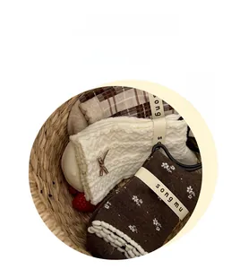 Three-pack vintage brown cotton socks featuring plaid, floral, and bow knit patterns