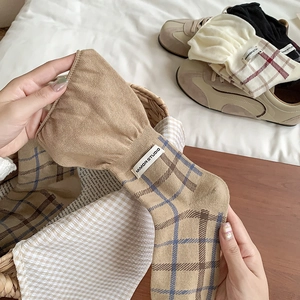 Vintage checkered crew socks in khaki with blue pattern and minimalist woven label detail