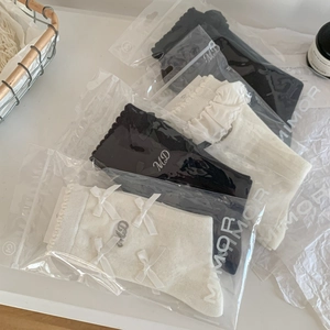 Chaussettes montantes Lolita avec nœuds et broderies en noir et blanc pour femmes