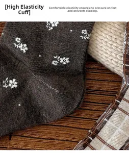 Detail of floral and plaid knit socks with high elasticity non-slip cuff on wood