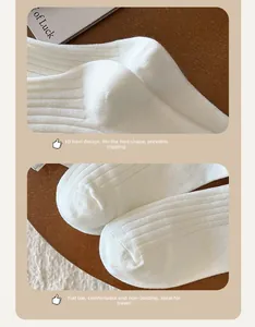Close-up of the reinforced three-dimensional heel and smooth toe seam of white socks