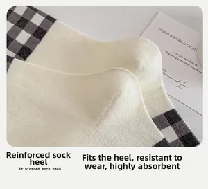 Detail of 3D ergonomic heel on knit cotton socks with gray checkered pattern