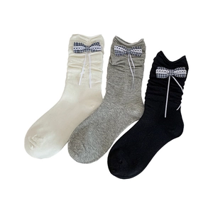 Three-pack ballet style ribbon plaid bow crew socks in white, grey, and black colors