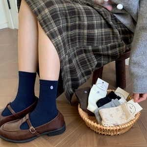 Women's cotton knit crew socks set with button detail in multiple neutral colors