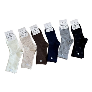 Multipack of six pairs of knit cotton socks with bow patterns in classic neutral colors