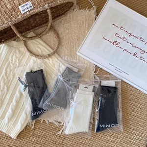 Lot de chaussettes avec nœuds et strass en coloris noir blanc et gris chiné