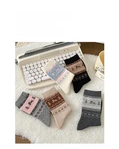 Fair Isle knit crew socks featuring cute puppy jacquard patterns in various neutral colors