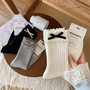 Japanese ballet style ribbed socks with lace trim and velvet bows in neutral colors