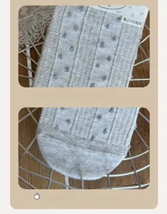 Close-up of seamless toe and reinforced heel on grey polka dot cotton crew socks