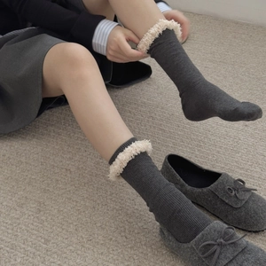 Chic dark grey crew socks with plush faux fur trim and ribbed texture for autumn winter