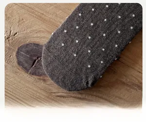 Close-up of reinforced sock head on ballet style polka dot mid-calf cotton socks