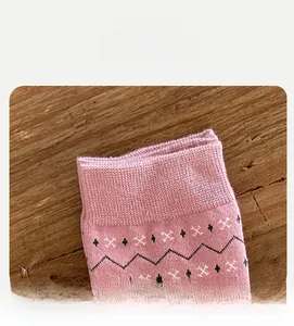 Detail of high elasticity pink Fair Isle sock mouth with vintage jacquard patterns
