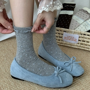 Ballet style socks with white polka dots on grey cotton fabric and ruffled hem design