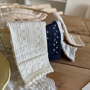 Polka dot knitted cotton crew socks with sweet ruffled lace trim in neutral colors