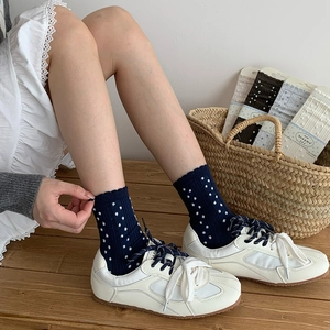 Navy blue cotton crew socks with white polka dots and cute ruffled cuffs for women