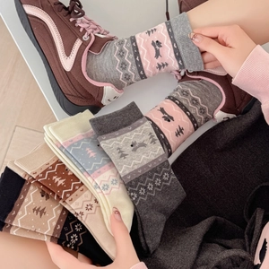 Fair Isle knit socks with dog patterns and Nordic geometric motifs for autumn