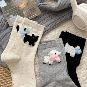 Tre paia di calze con animali in crema, grigio e nero con simpatiche applicazioni 3D