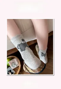 Detail view of grey cat socks with 3D ears and non-slip ribbed cuffs for women