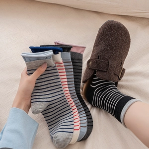 Cozy striped crew socks set with rolled cuffs for women in various pastel colors
