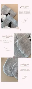 Detailed views of grey penguin socks showing elastic cuff, comfort heel and reinforced toe