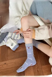 Close-up of cute koala embroidery and soft knit texture on wool blend socks