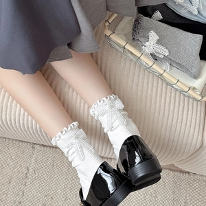 White ballet style calf socks with pearls, lace bows and frilled edges for girl